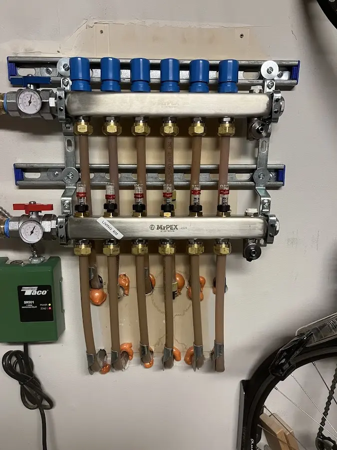 Plumber performing Water Heater Repair at a residential property in Virginia